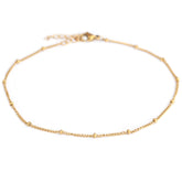 Bracelet de cheville à pois dorés